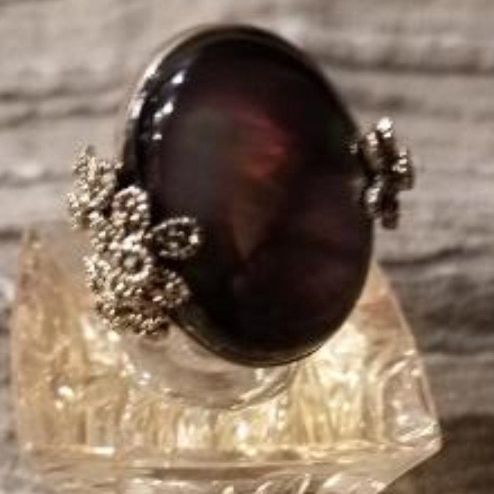 Moon opal ring with silver accents . Size 7 and absoutly stunning